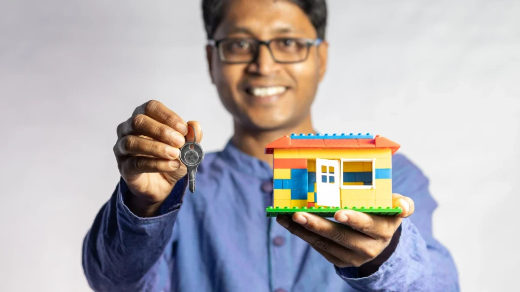 A modern house key with a digital CIBIL score of 780 on its head, unlocking the door to a new home.