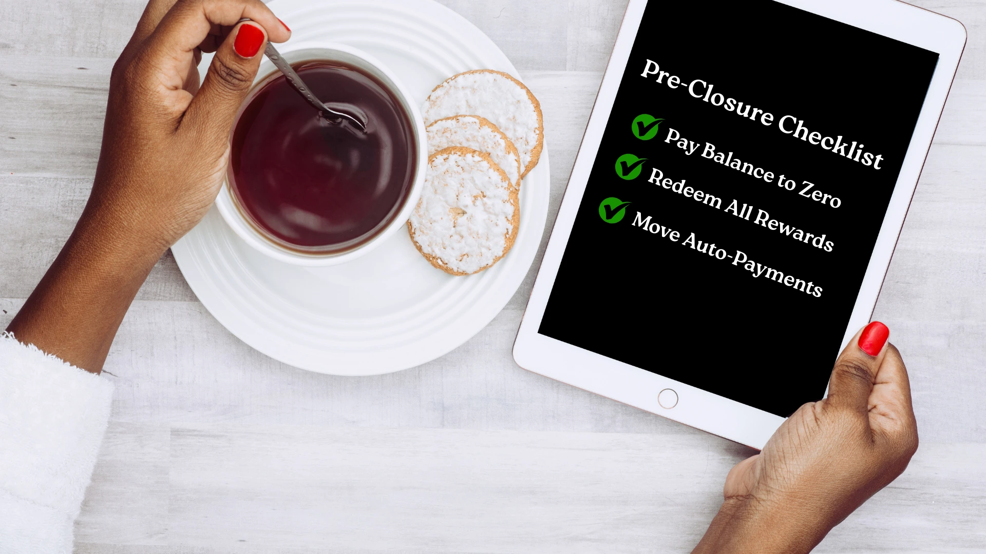 A person reviewing a pre-closure checklist on a tablet before closing their credit card, a key step in how to close a credit card without affecting CIBIL score.